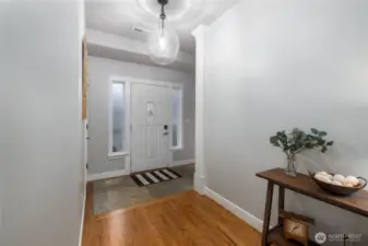 Stone floor at the front door handles rainy PNW days with grace.