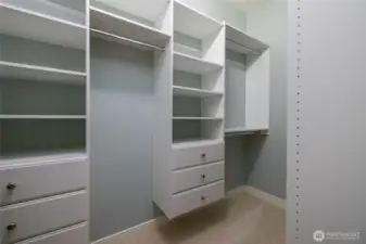 Primary suite walk-in closet - giving Closet Envy vibes with the built-in closet storage system that includes drawers, shelves, and lots of hanging space.