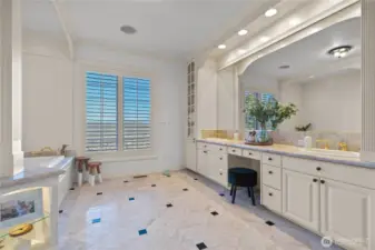 Primary bath has jetted tub and walk-in shower with amazing views.