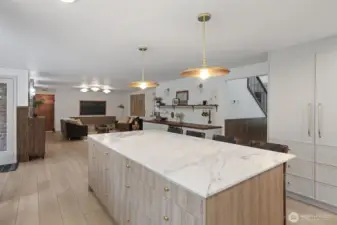 Designed for connection, the kitchen opens effortlessly to the expansive family room, creating a bright, inviting gathering space. Just off to the left, the large covered deck extends your living outdoors—ideal for entertaining in any season.