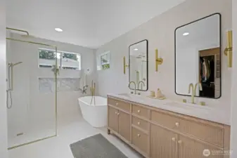 An absolutely stunning, spa-inspired oversized 5-piece primary bath featuring a freestanding soaking tub, walk-in shower, dual vanities, and elegant finishes throughout. A separate water closet is privately positioned to the left, completing this luxurious retreat.