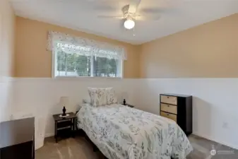 Another upstairs bedroom with street view.