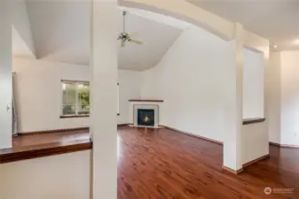 Extra large open great room with designer columns and beautiful wood floors and wood work!