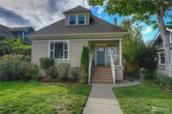 Cute front porch has room for a chair.