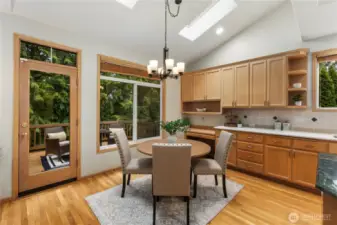 Family dining with large windows to deck