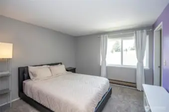 Additional view of the primary suite, highlighting its inviting atmosphere and layout.