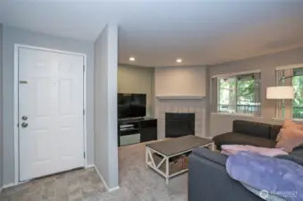 Open and inviting from the moment you enter this end-unit condo.