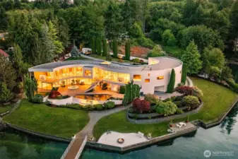 An Icon Revealed – The S House on Wollochet Bay. This architectural tour de force curves along 335’ of private waterfront, showcasing its signature S-shaped design, two stories of glass, and rare deepwater dock. A one-of-a-kind Gig Harbor estate where light, water, and luxury converge