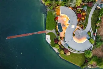 A true work of art from above – the S House’s iconic curves embrace dual circular courtyards and frame panoramic bay views. With 335’ of private shoreline, manicured grounds, and a rare deepwater dock, this Gig Harbor estate is as functional as it is unforgettable