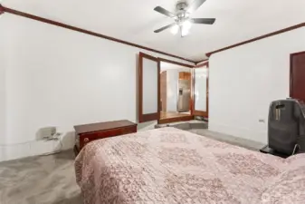 Primary Bedroom with French doors & ceiling fan