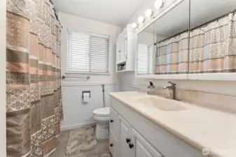 Bathroom with Italian tile floor & shower w/ jetted tub.