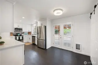 dining with french doors to covered patio