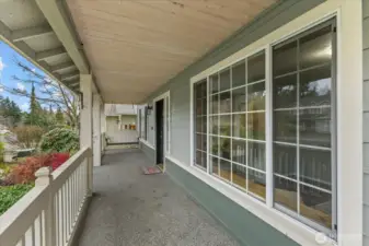 What a cute entry with the porch swing!