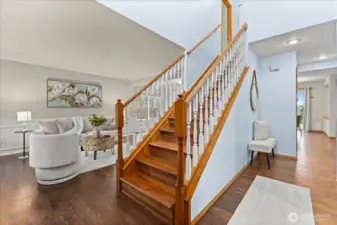 Beautiful entry with hardwood floors and charming staircase!