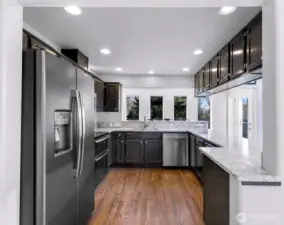 Updated kitchen with quartz countertops.
