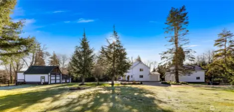 Acreage, outbuildings and mature landscaping