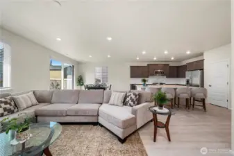 Open layout of the great room with view of the eat-in kitchen