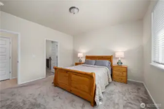 Primary suite, bathroom door to the left