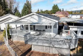 Spacious deck offers river vistas, soaring eagles, and blossoming trees; a perfect spot for morning coffee.