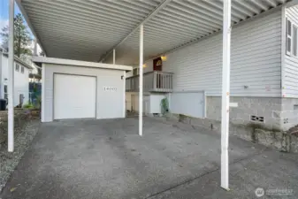 Spacious two-car covered carport with a large storage shed with tons of space, all connected to the home for comfortable access year-round.