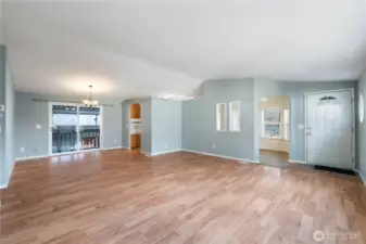 Light-filled living room with a slider leading out to the deck for easy indoor-outdoor living.