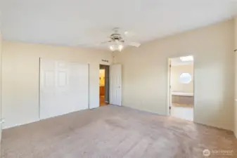 The generous primary bedroom leads into an adjoining five-piece bathroom, forming a quiet and functional primary suite.