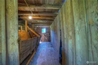 feeding trough inside of the barn.