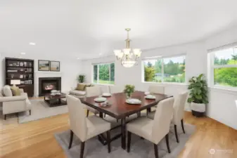Formal Dining Room, and Family Room with gas fireplace beyond. Lot's of natural light, and a great view of the huge backyard.