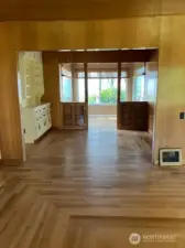 Mini Reno Results Sunroom, flooring, built-ins; looking in from the living room