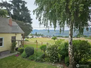 Behind garage and upper living space