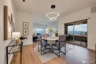 Lovely dining area which leads to spacious private covered deck to watch the sunsets over the Olympic Mtns.