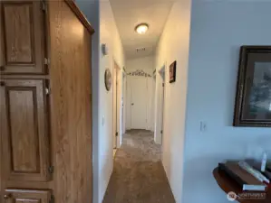 Hallway to 2 bedrooms, Main bathroom and laundry room.