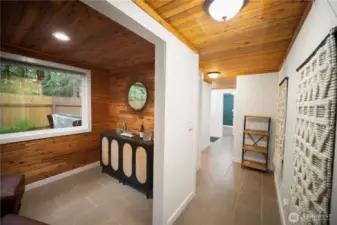 You can see the open hot tub through the window. Down the main-level hall to check ou tthe bathroom and kitchen.
