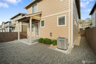Low maintenance backyard with covered patio