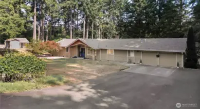 nestled amidst the enchanting beauty of old-growth firs on a sprawling 4.2-acre lot.