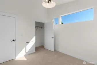 Spacious ADU bedroom with oversized window.