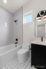 Contemporary ADU full bath with designer touches.