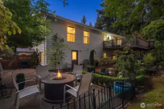 Enjoy the peaceful garden ambiance. The multi-level design offers both lounging and dining areas—perfect for entertaining or unwinding under the trees.
