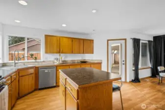 Laundry room view into kitchen and back door.