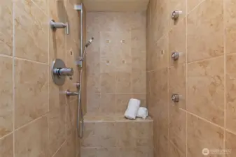 Check out this shower with the multi-head shower system.