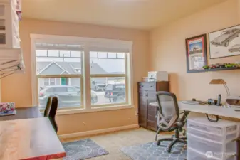 THIRD BEDROOM (from bedroom door): Carpeted Flooring; Two North-Facing Street-View Windows with 2" Horizontal Vinyl Blinds (closet off frame to the right)