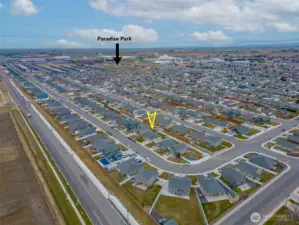 AERIAL VIEW LOOKING SOUTHEAST: Home Sits on a Bend in the Road to the West, Naturally Slowing Traffic; Nearby Park Visible to the Southeast