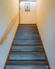 Upstairs apartment stairs from entryway on main floor