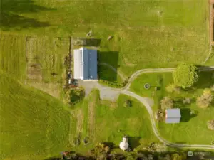 Aerial of farmhouse, farmstand, and yurt