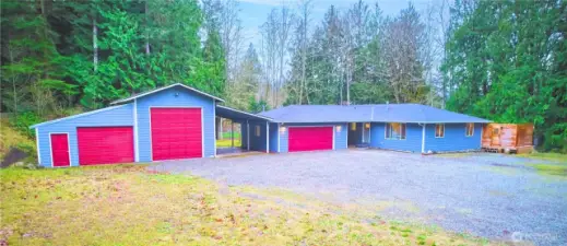 Welcome home to your 5 acre oasis with smart, single level home and dual shops/garages for all your needs!