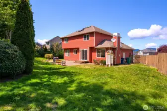 the back of the house from the far corner of the yard