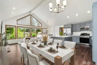 Open living & brand new kitchen with vaulted ceilings, dining area leads to large deck & fence backyard with all new floors. (Virtually staged)