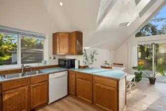 Natural light flows throughout the dining and kitchen space.
