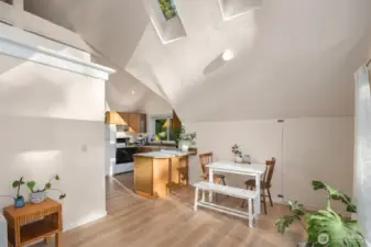 Vaulted ceiling with skylights highlights the living space.