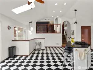 Open kitchen with stairs to lower level.